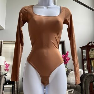 SKIMS Long Sleeve Bodysuit in Tan